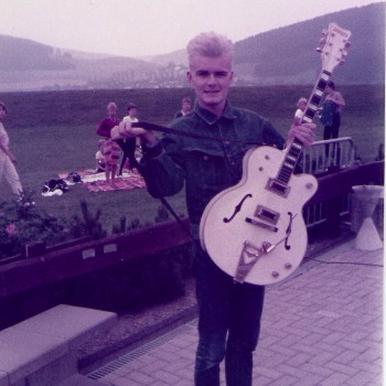 Billy shows off his prized Gretsch White Falcon in 1984