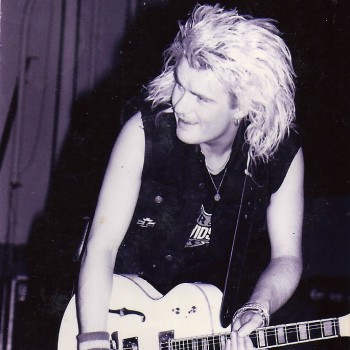 Billy onstage with The Cult in 1987