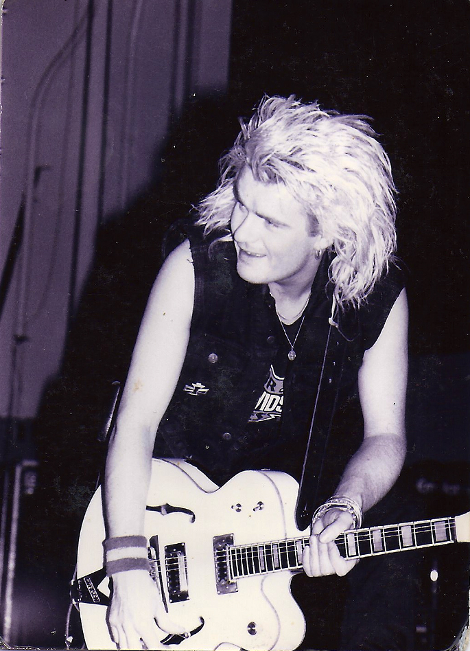 Billy onstage with The Cult in 1987